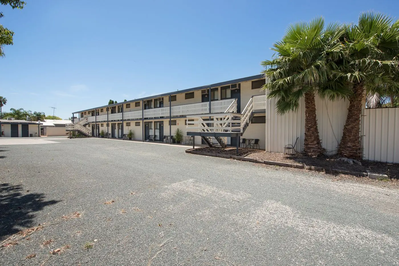 The two-storey motel building and its car park