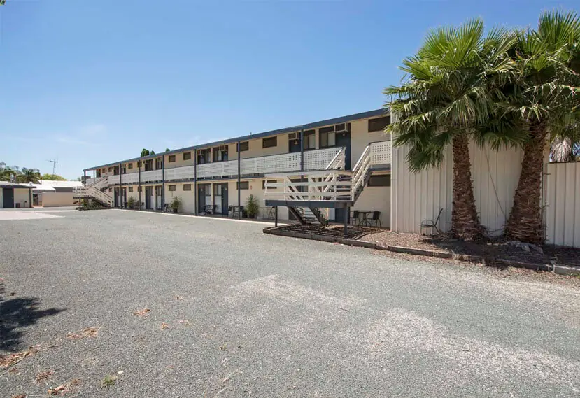 The two-storey Pioneer Station Motor Inn building and its large car park